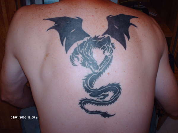 start of dragon backpiece tattoo
