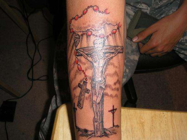 jesus/rosary piece. tattoo