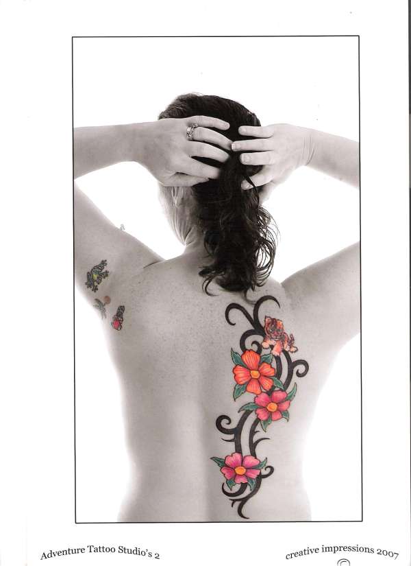 professional photo of caths back tattoo