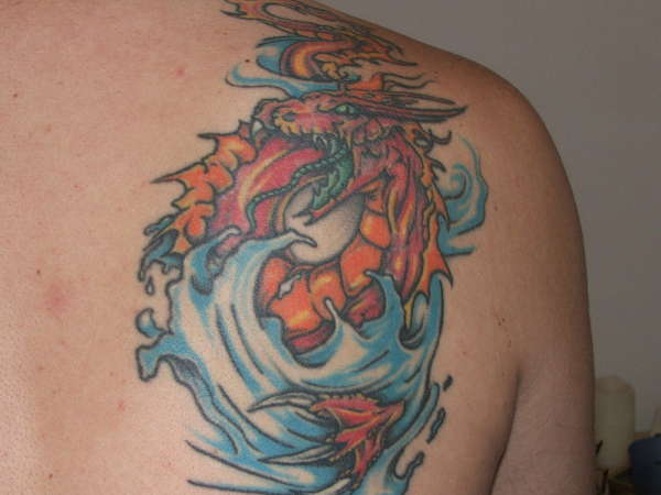 Orange Dragon in water tattoo