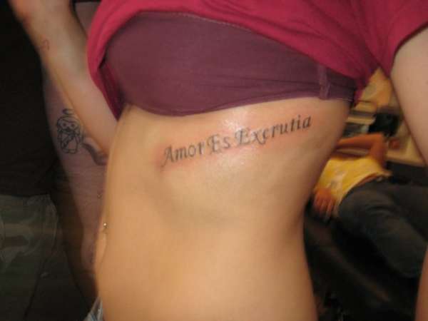 Amor Es Excrutia tattoo