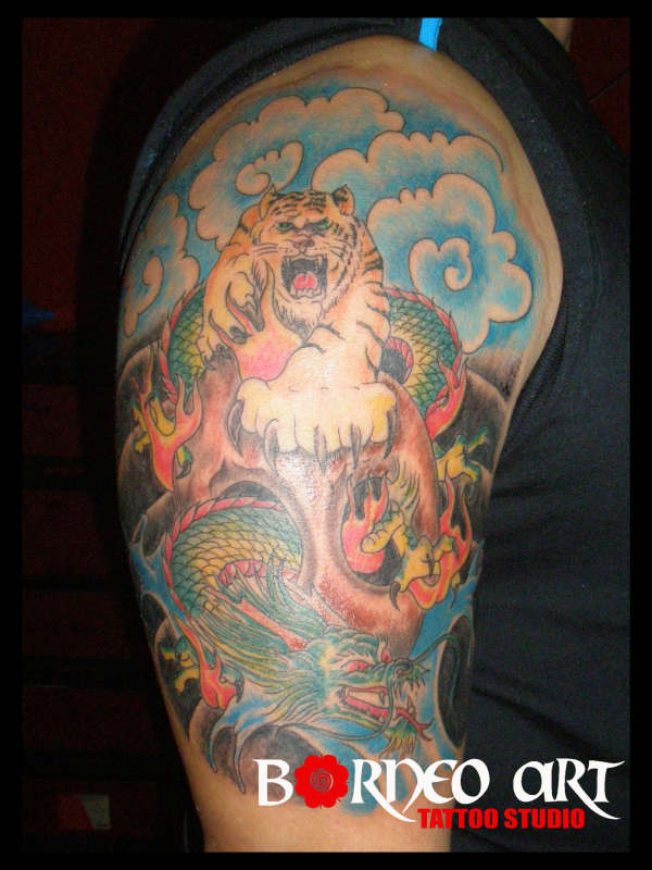 Dragon vs tiger by Reynold tattoo