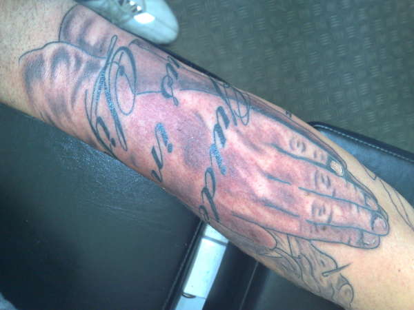 praying hands from sleeve tattoo