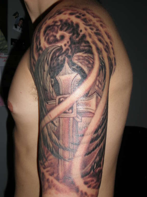 Cross with wings tattoo