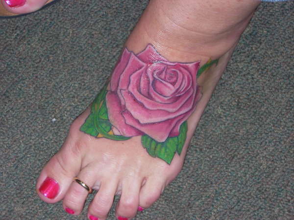 Rose on the foot tattoo
