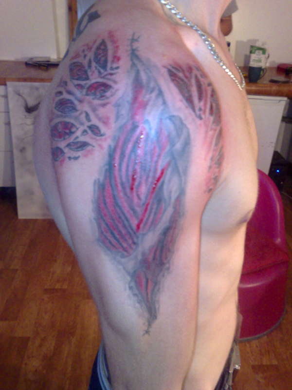 Torn skin tattoo done by lee at monstarz-ink tattoo