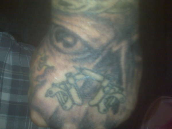 skull on my hand with tattoo machines in it tattoo