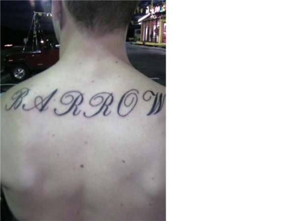 last name on back tattoo
