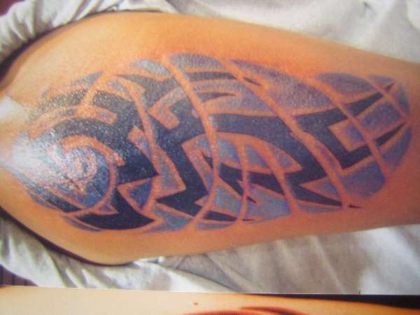 tribal with blue wind backgroung tattoo