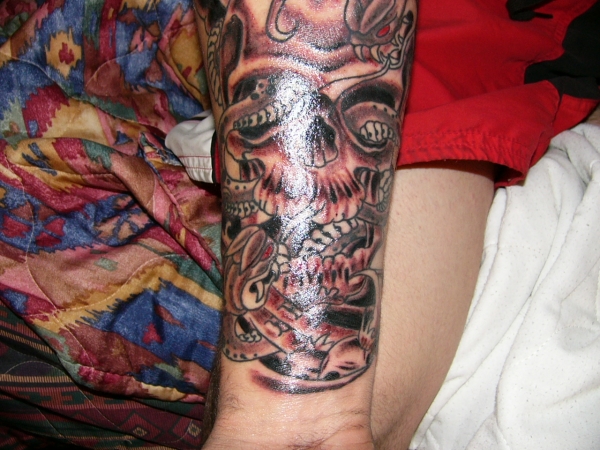 Skull and snakes tattoo