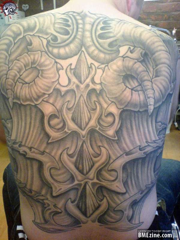 black and grey back piece tattoo