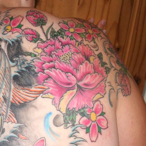 flower in my back piece tattoo