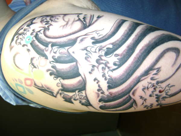 tribal sunami waves tattoo