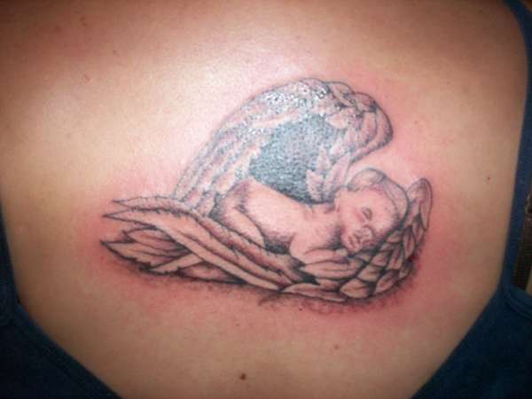 Black/Grey baby in wings tattoo