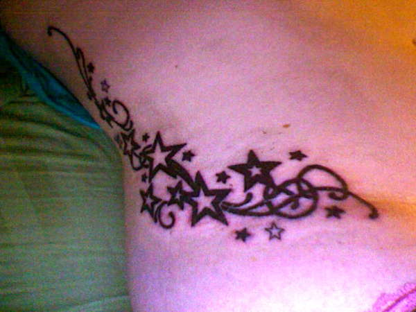 Stars and swirls tattoo