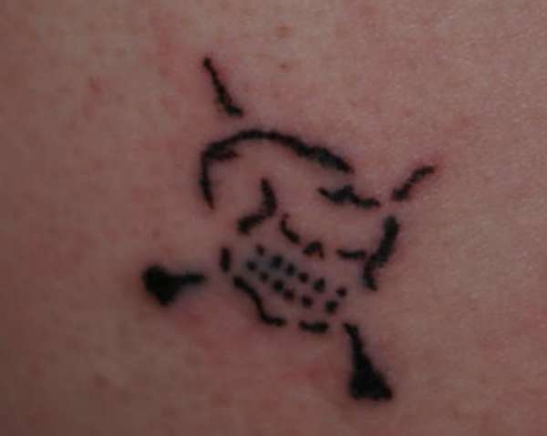 Shotgun Toschi's little skull tattoo