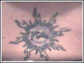 Dolphins in ocean sun tattoo