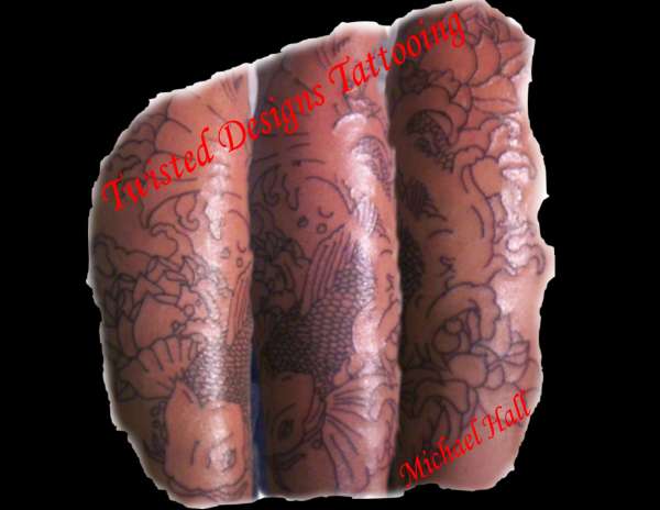 Koi Fish on lower forearm tattoo