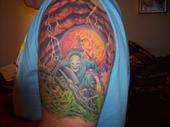 Reaper on bike tattoo