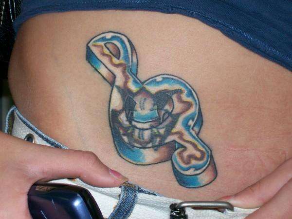 Chrome Treble Clef tattoo