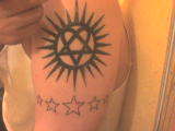 Heartagram with stars tattoo