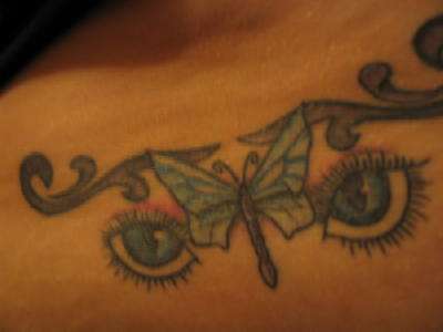 butterfly and eyes tattoo