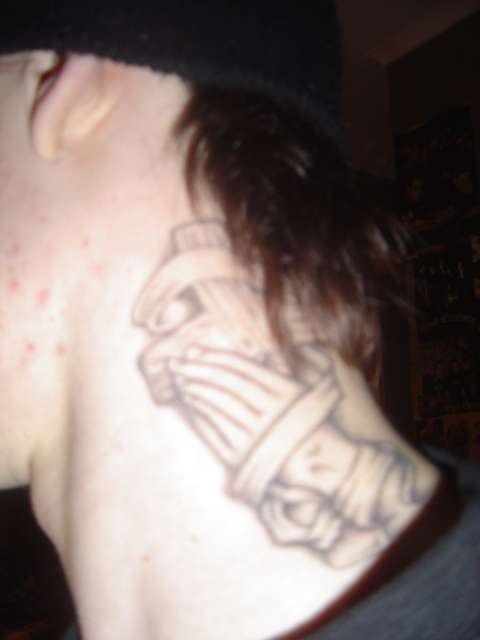 Prying hands and cross tattoo