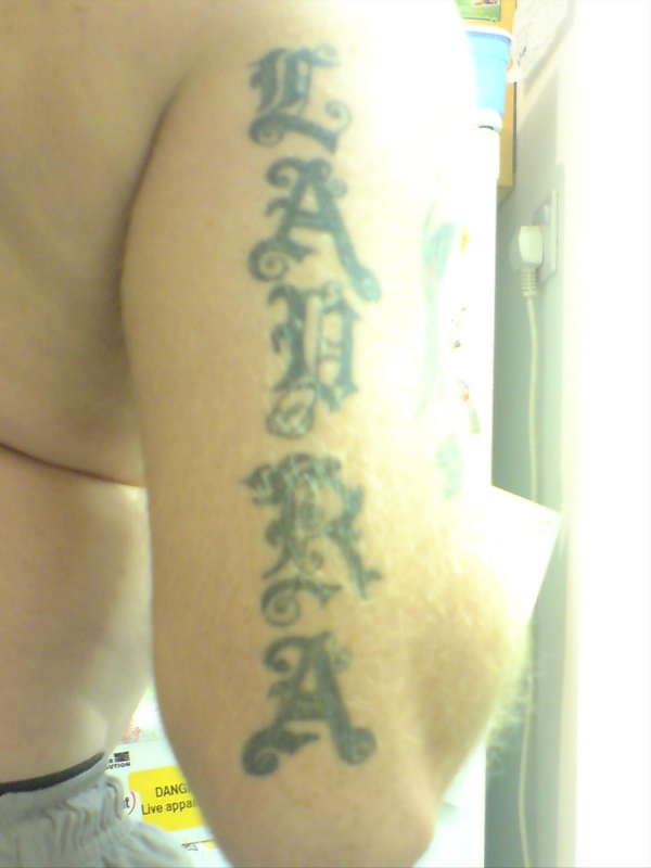laura, right upper arm - rear tattoo