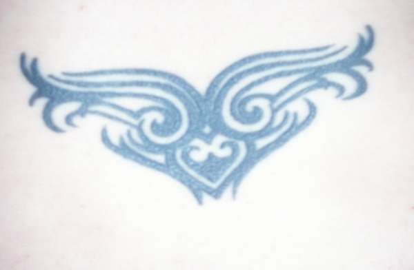tribal lower back tattoo