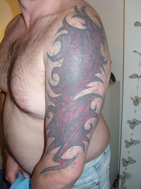 Tribal muscle tissue tattoo