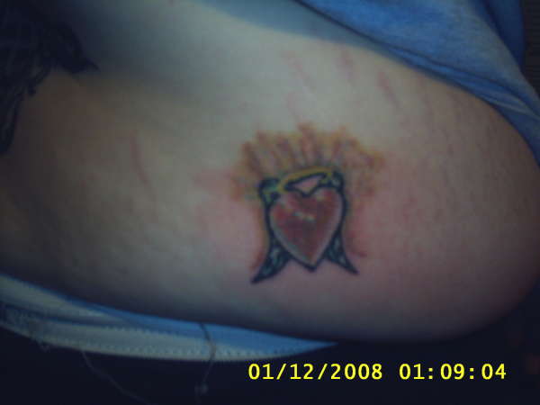 tiny heart tattoo