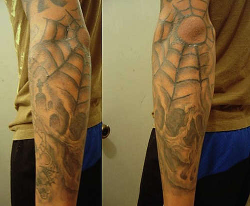 smoke skull webs tattoo