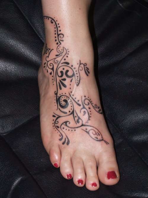 tribal gecko lizard on foot tattoo