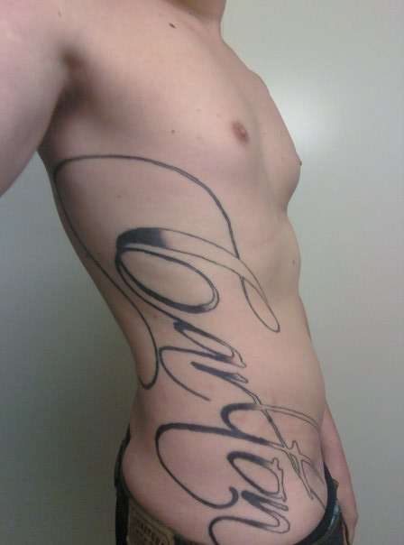 Last name down full ribs/side -- Calligraphy Font tattoo