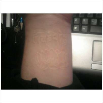 om mane padme hum and lotus (white tattoo) tattoo