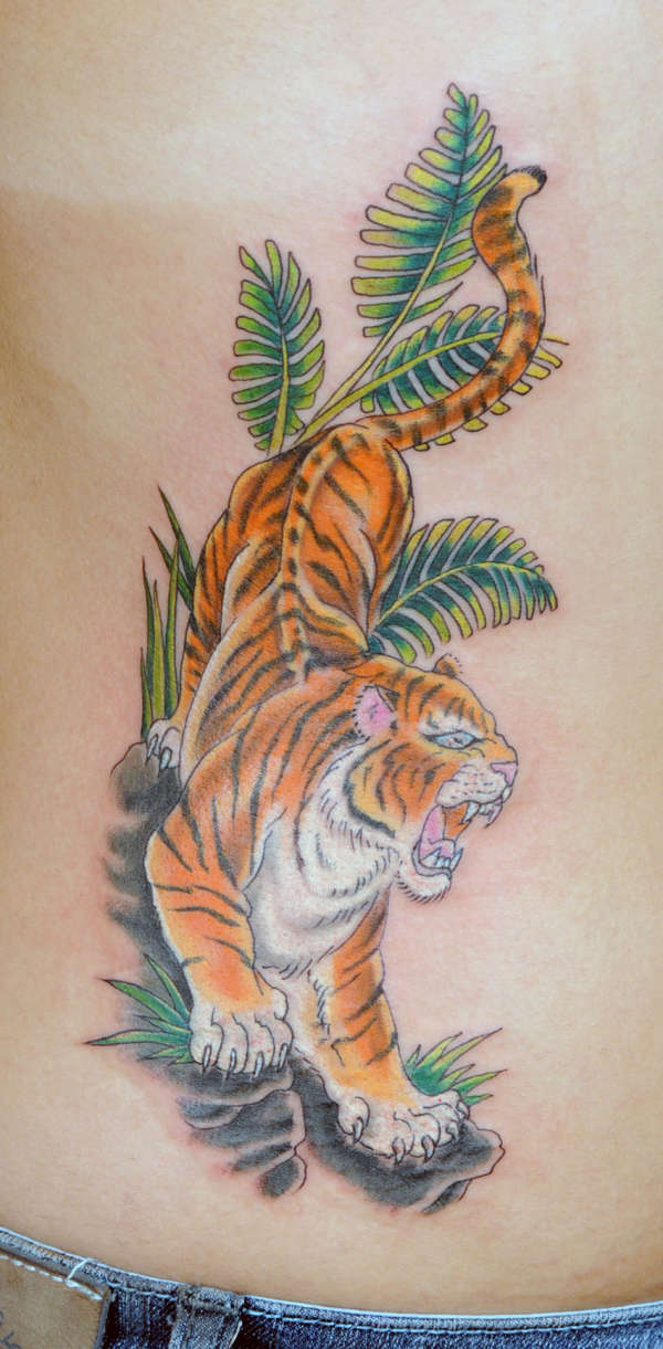 Tiger on ribs tattoo