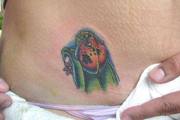 Small ladybug tattoo