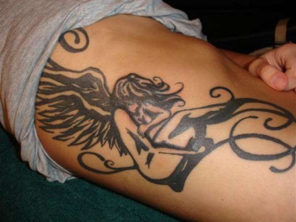 Angel rib piece tattoo