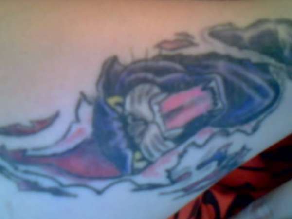 panther ripping out tattoo