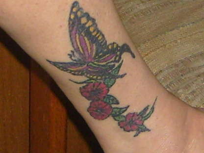 My ex-wifes butterfly with flowers tattoo