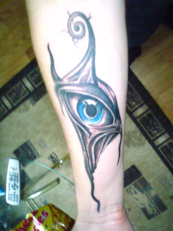 Eye thing on arm tattoo