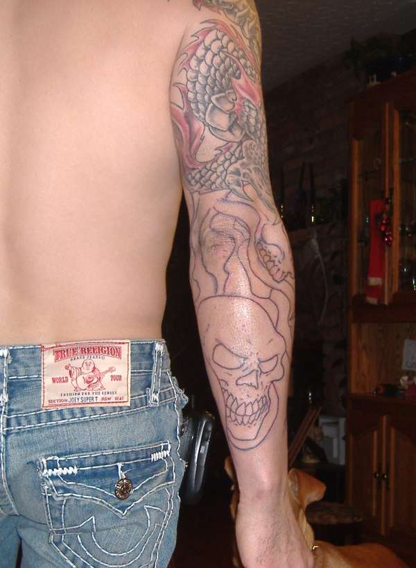 dragon and skulls tattoo
