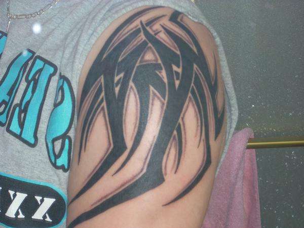 Right arm tribal tattoo