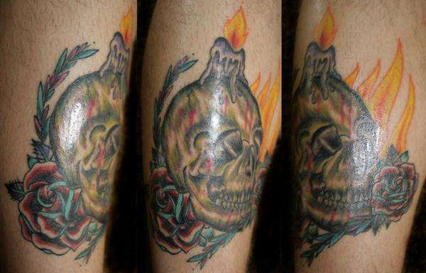 skull with candle tattoo