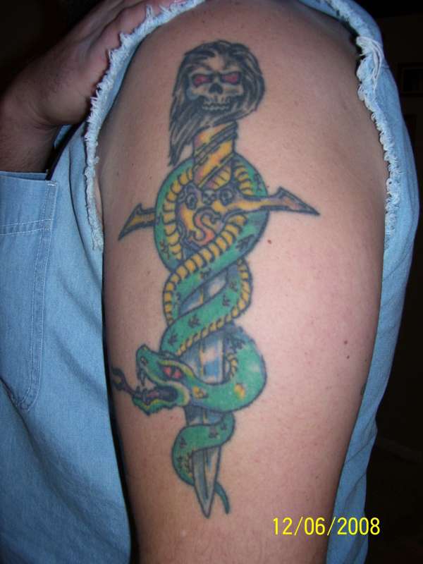 Snake with dagger tattoo
