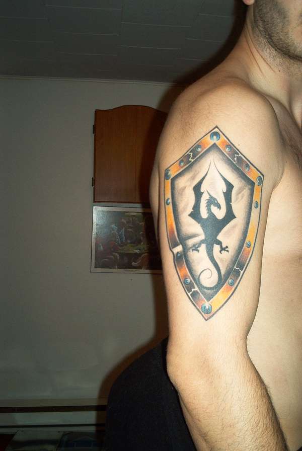 shield with tribal dragon tattoo