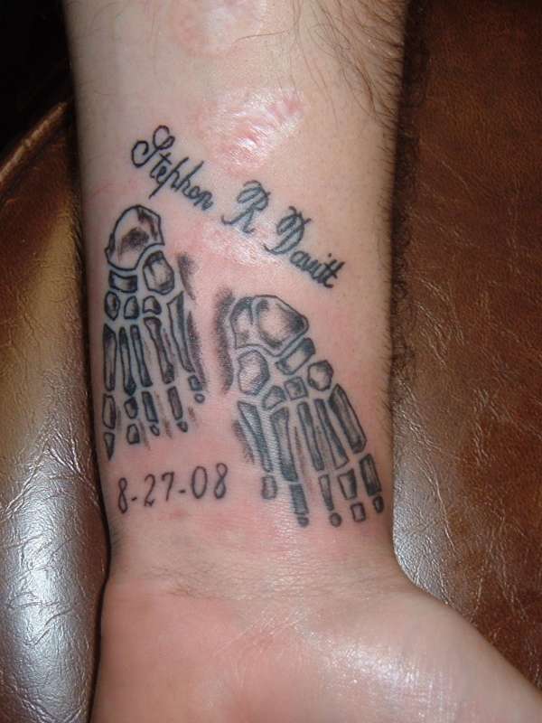 Skeleton feet tattoo