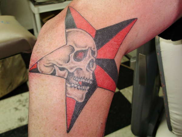 scull in a star tattoo