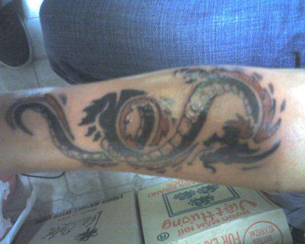 Dragon i did on the inside arm above the rist tattoo