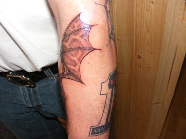 skull/wing/injection stacks tattoo
